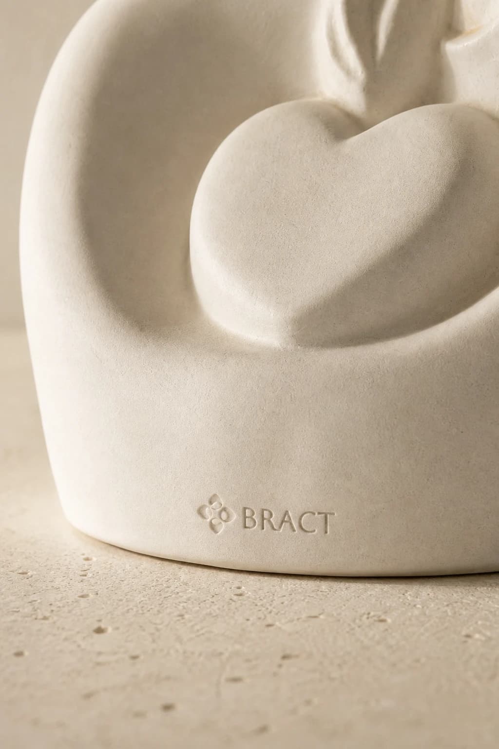 Embrace Heart Sculpture — BRACT engraved detail